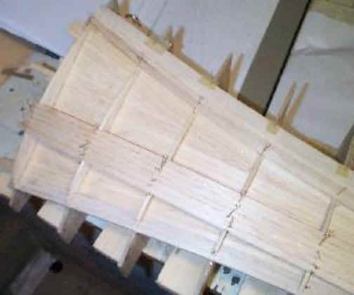 upper surface planking in progress on the rotor blade plug